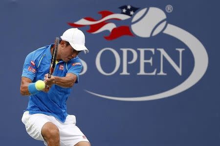 Aug 31, 2015; New York, NY, USA; Kei Nishikori of Japan returns a shot to Benoit Paire (not pictured) of France on day one of the 2015 U.S. Open tennis tournament at USTA Billie Jean King National Tennis Center. Mandatory Credit: Geoff Burke-USA TODAY Sports