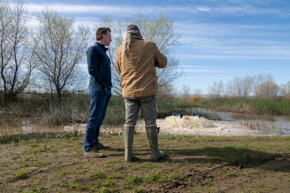 Gov. Gavin Newsom tours Brian and Elena Corral’s 810 acres of Dunnigan farmland Friday to observe how recycled collected water is being used to flood the property to recharge Yolo County’s groundwater aquifer. Newsom announced an end to some of the state’s water restrictions.