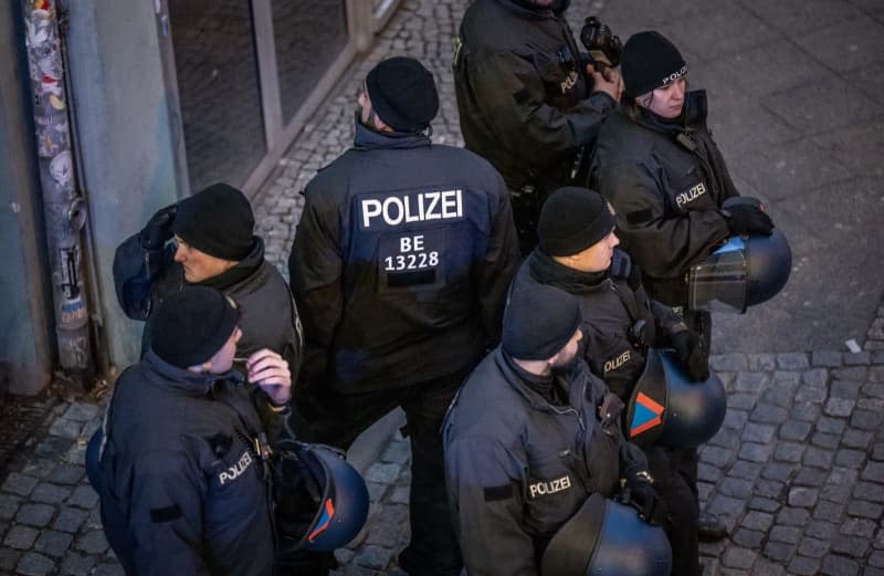 Police officers gather during a pro-Palestinian demonstration at Kottbusser Tor in the neighborhood of Kreuzberg during the New Year's Eve. Michael Kappeler/dpa