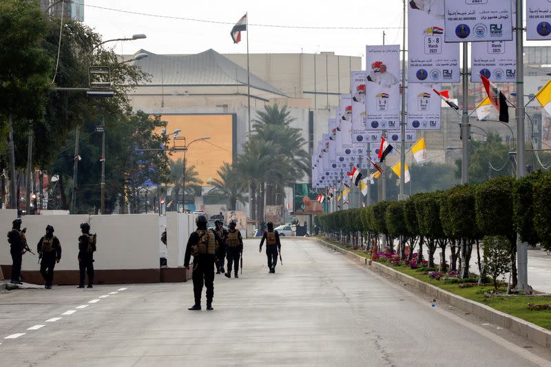 Iraqi security members are deployed during a curfew ahead of the Pope Francis arrival, in Baghdad