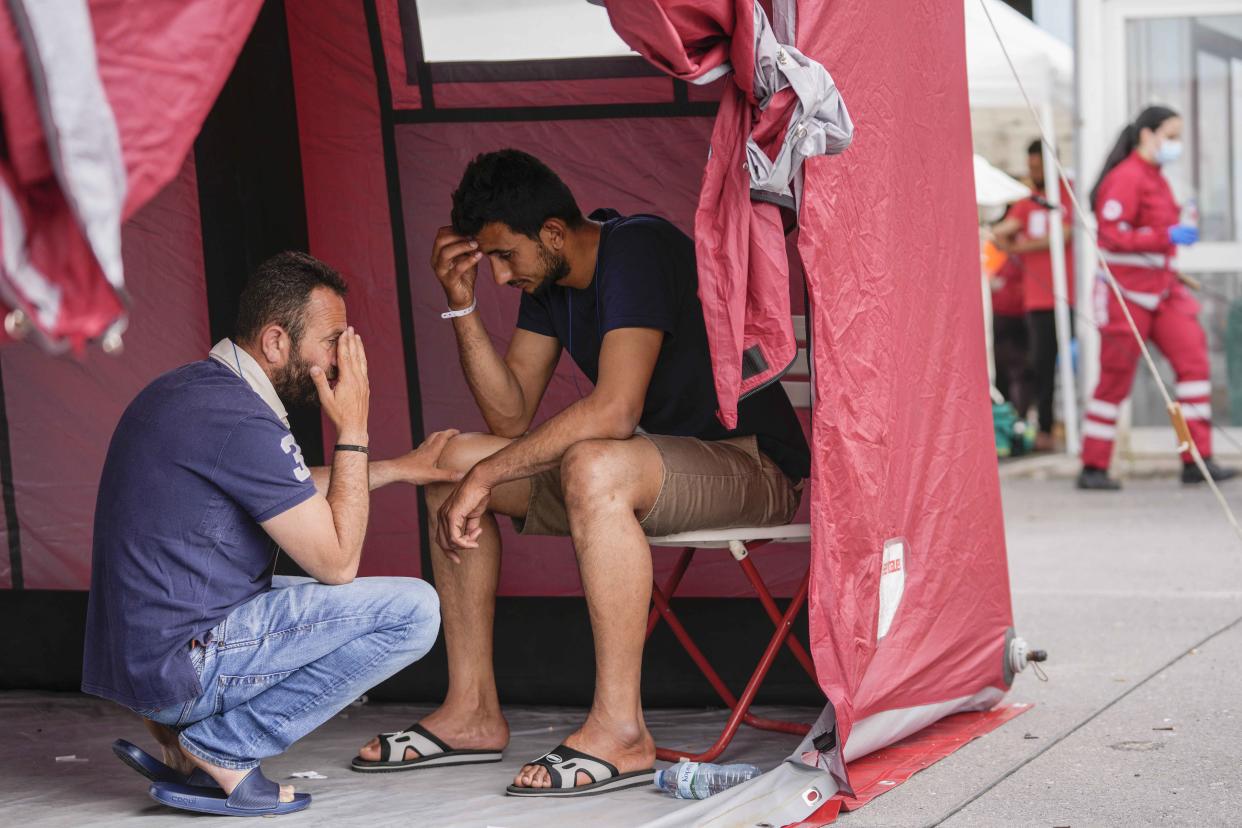 A fishing boat crammed to the gunwales with migrants trying to reach Europe capsized and sank Wednesday June 14 off the coast of Greece, authorities said, leaving at least 79 dead and many more missing in one of the worst disasters of its kind this year.  (Thanassis Stavrakis / AP)