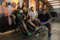 CORRECTS LAST NAME TO KIRKPATRICK FROM KILPATRICK This Aug. 15, 2019 photo shows, from left, Danny “KP” Kirkpatrick, Erica "Barbie" Thompson, Christian "Ink Drippin'" Thomas and Timothy "Tim" Simmons, cast members in the reality television series "Black Ink Crew: Compton," at the IAM Compton tattoo shop in Compton, Calif. The show, which airs Wednesdays on VH1, follows the cast who attempt to create a “safe zone” in one of the tougher cities in California. The reality series is the third spinoff of the “Black Ink Crew” franchise. (Photo by Chris Pizzello/Invision/AP)