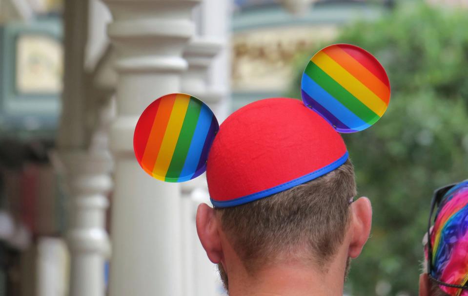 A guest wears a Pride-themed Mickey Ears hat at Walt Disney World's Magic Kingdom on June 3.