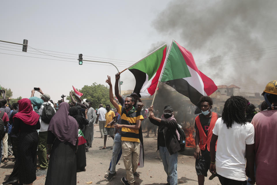 Sudanese anti-military protesters march in demonstrations in the capital of Sudan, Khartoum, on Thursday, June 30, 2022. A Sudanese medical group says multiple people were killed on Thursday in the anti-coup rallies during which security forces fired on protesters denouncing the country’s military rulers and demanding an immediate transfer of power to civilians. (AP Photo/Marwan Ali)