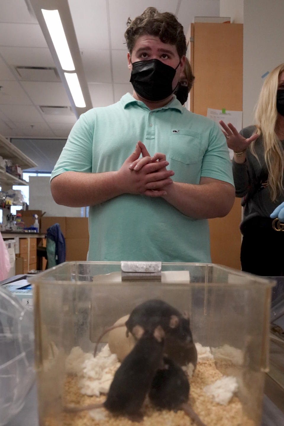 Jake Litvag, 16, visits a lab at Washington University where doctors are studying a rare form of autism linked to a mutation in the MYT1L gene using mice with the same mutation as Jake Wednesday, Dec. 15, 2021, in St. Louis. (AP Photo/Jeff Roberson)