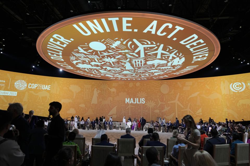 Delegates arrive for a meeting at the COP28 U.N. Climate Summit, Sunday, Dec. 10, 2023, in Dubai, United Arab Emirates. (AP Photo/Peter Dejong)