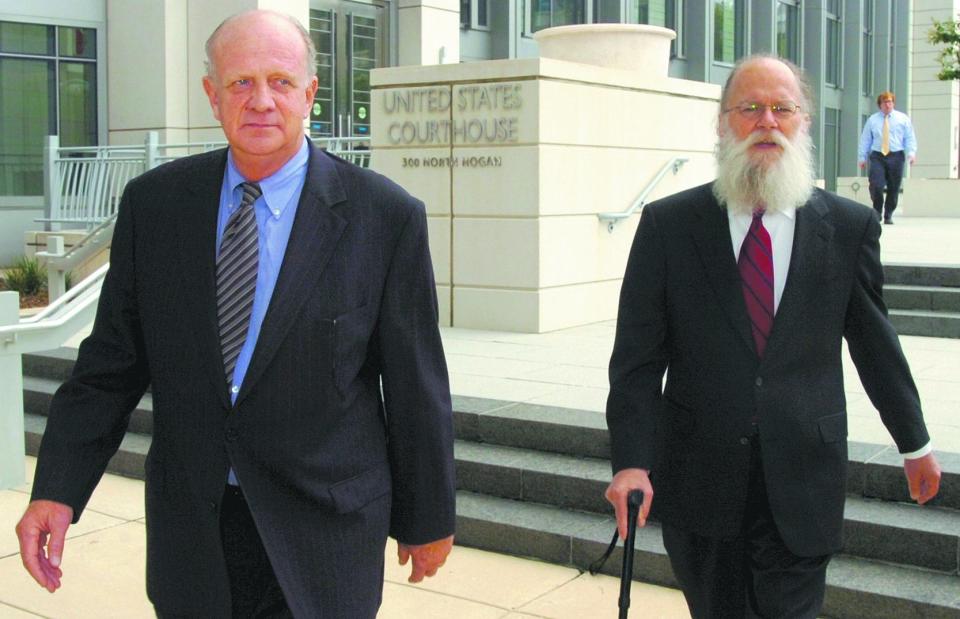 Former St. Johns County Commission Chair Tom Manuel (left) leaves Jacksonville's federal courthouse with his attorney, Bill Sheppard, after pleading guilty to soliciting a bribe in 2009.