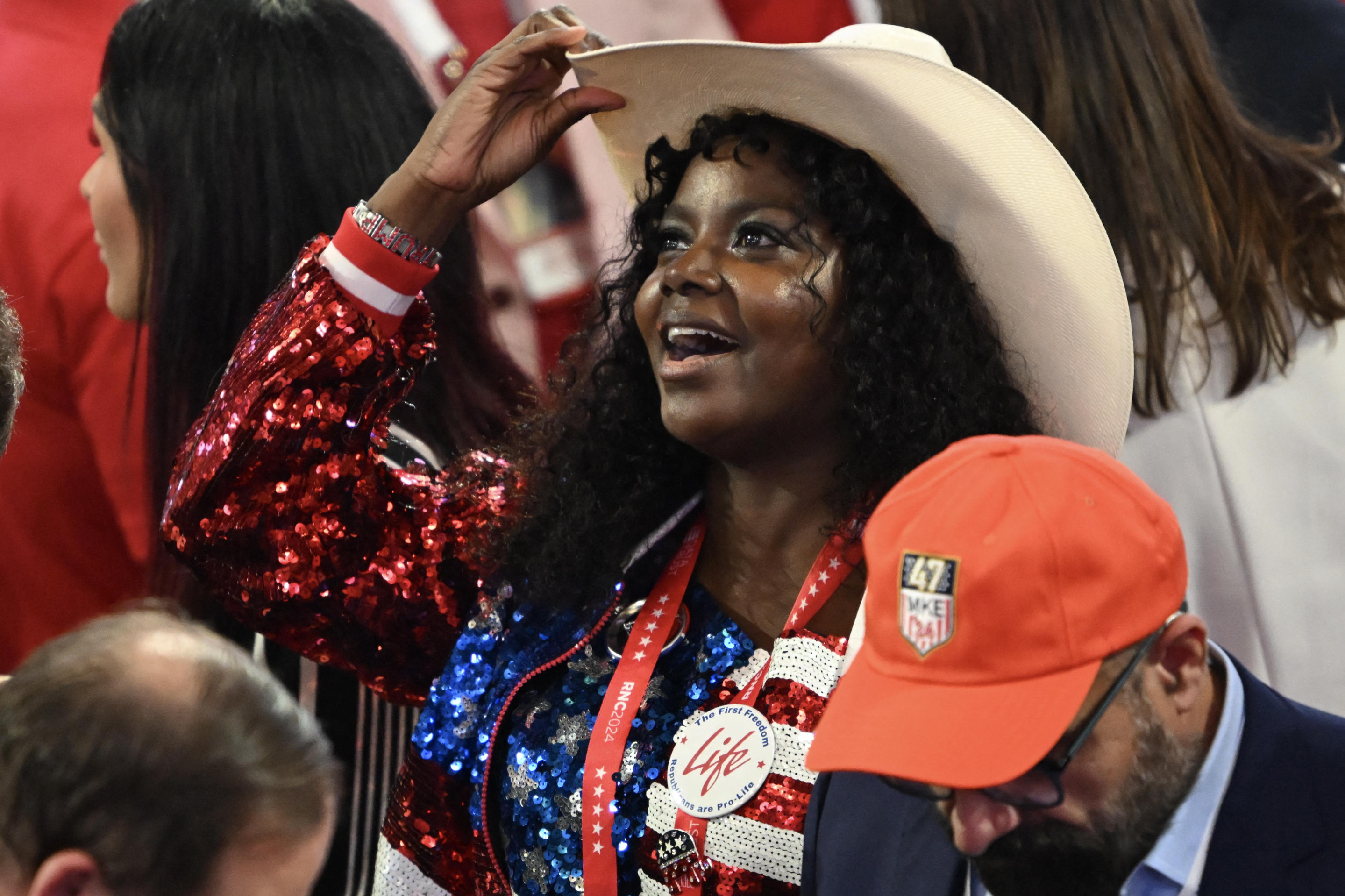 A delegate wears a sequined red-white-and-blue outfit at the convention. 