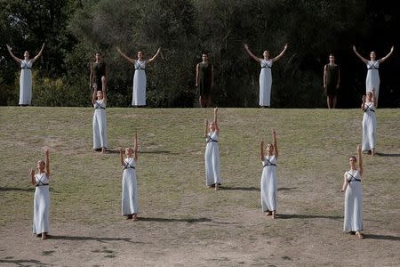 Olympics - Dress Rehearsal - Lighting Ceremony of the Olympic Flame Pyeongchang 2018 - Ancient Olympia, Olympia, Greece - October 23, 2017 Actors perform during the dress rehearsal for the Olympic flame lighting ceremony for the Pyeongchang 2018 Winter Olympic Games at the site of ancient Olympia in Greece REUTERS/Costas Baltas