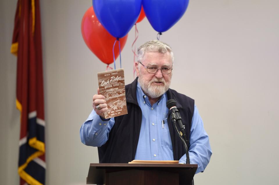 Oak Ridge historian Ray Smith holds a program from the original gates-opening ceremony in 1949 during his presentation at the American Museum of Science & Energy (AMSE) in Oak Ridge, Tenn., Tuesday, March 19, 2024. The event was the 75th anniversary of the gates opening in Oak Ridge and the museum. Speaking on how rare the program is, Smith told the AMSE crowd, "No, you can't have it!"