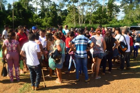 Relatives of prisoners wait for news after a prison riot, in front of a prison in Altamira