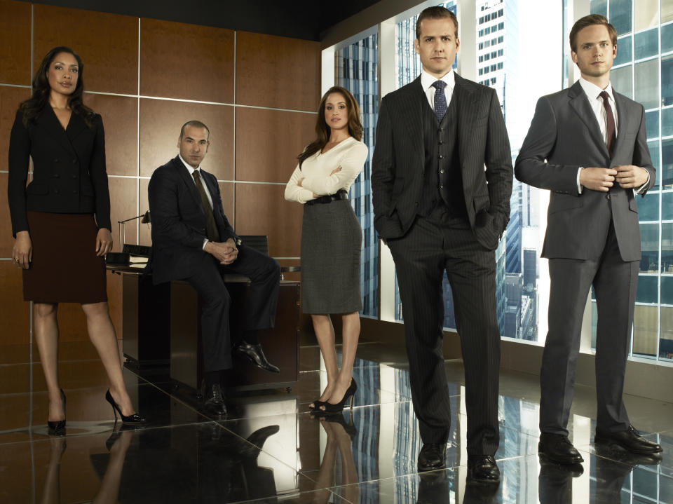 SUITS -- Season 1 -- Pictured: (l-r) Gina Torres as Jessica Pearson, Rick Hoffmann as Louis Litt, Meghan Markle as Rachel Zane, Gabriel Macht as Harvey Specter, Patrick Adams as Mike Ross -- (Photo by: Frank Ockenfels/USA/NBCU Photo Bank/NBCUniversal via Getty Images)