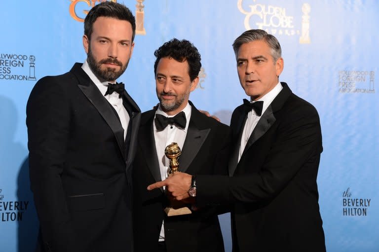 (L-R) Actor-director Ben Affleck and producers Grant Heslov and George Clooney with the award for best motion picture drama for "Argo" at the Golden Globe awards on January 13, 2013. "Argo" won the top two Golden Globes last weekend and is nominated for seven prizes at next month's Academy Awards