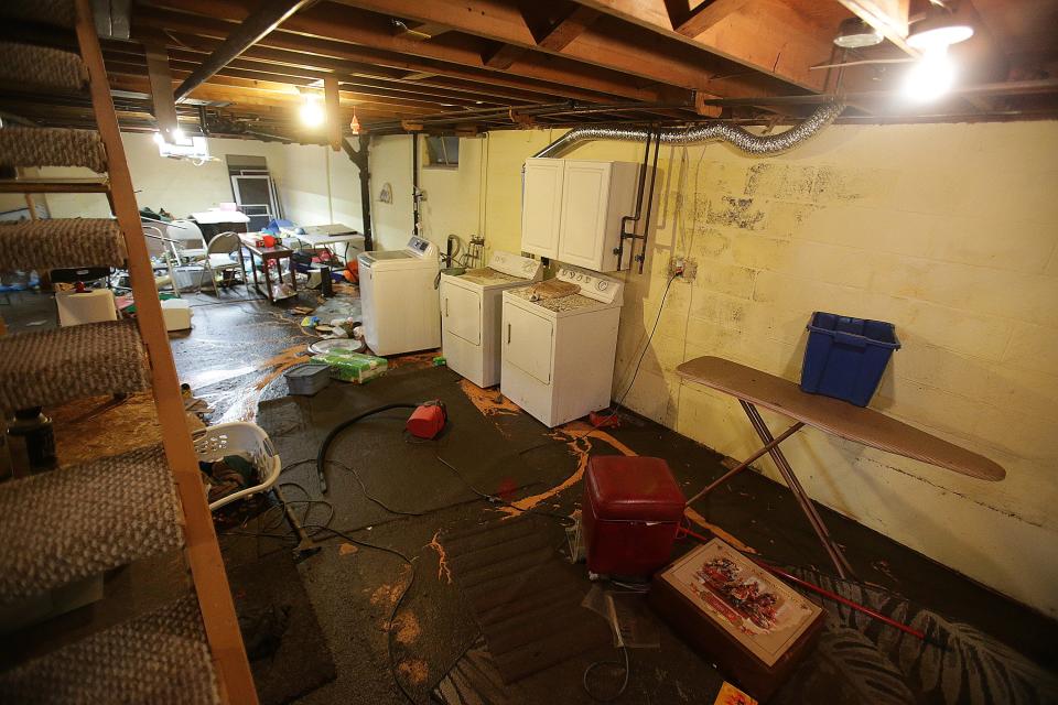 Judy Meade's basement was flooded following a heavy storm that struck the North Canton area on Saturday. She and her husband are still cleaning up.