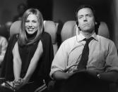 <p>When Rachel decides to fly across the pond for Ross's wedding, she shares the row with British actor Hugh Laurie, who is less than pleased to be seated next to her.</p>