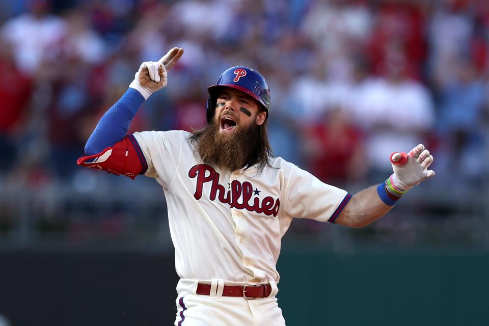 The Phillies' Brandon Marsh celebrates hitting a double against the Braves during Game 4 of the NLDS at Citizens Bank Park in Philadelphia on Oct. 15, 2022.