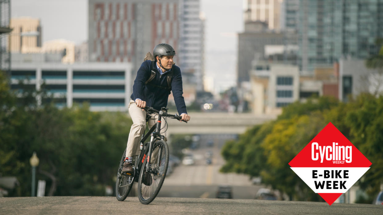  Male cyclist riding an electric bike in a city 