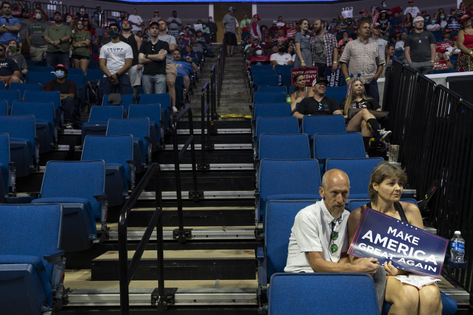 Attendees listen during a rally with U.S. President Donald Trump in Tulsa, Oklahoma, U.S., on Saturday, June 20, 2020. President Trump's first campaign rally since the coronavirus pandemic took hold in the U.S. drew far fewer supporters than the president and his advisers had predicted. (Photographer: Go Nakamura/Bloomberg/Getty Images)