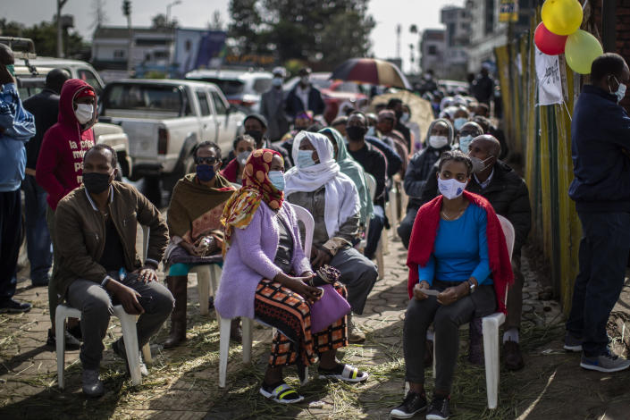 FILE - In this Monday, June 21, 2021 file photo, Ethiopians queue on chairs in the street as they wait to cast their votes in the general election at a polling center in the capital Addis Ababa, Ethiopia, Monday, June 21, 2021. Ethiopia's ruling Prosperity Party was declared on Saturday, July 10, 2021 the winner of last month's national election in a landslide, assuring a second term for Prime Minister Abiy Ahmed. (AP Photo/Ben Curtis, File)