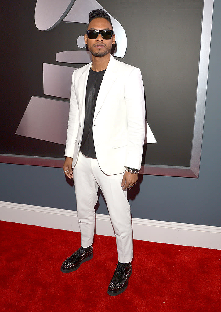 <b>Miguel</b><br> <b>Grade: B+</b><br> Miguel – whose “Adorn” was nominated for Song of the Year – stepped out in a crisp white blazer and matching pants. Studded black shoes completed his stylish ensemble.