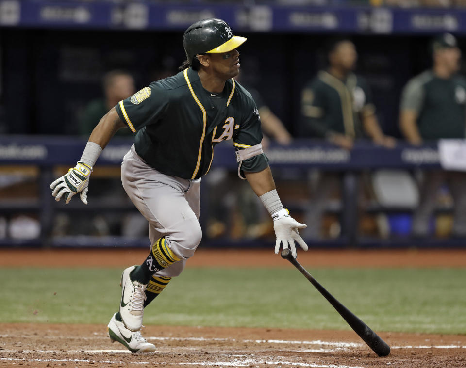 Oakland Athletics' Khris Davis watches his home run off Tampa Bay Rays pitcher Jaime Schultz during the 10th inning of a baseball game Friday, Sept. 14, 2018, in St. Petersburg, Fla. Oakland defeated Tampa Bay 2-1.(AP Photo/Chris O'Meara)