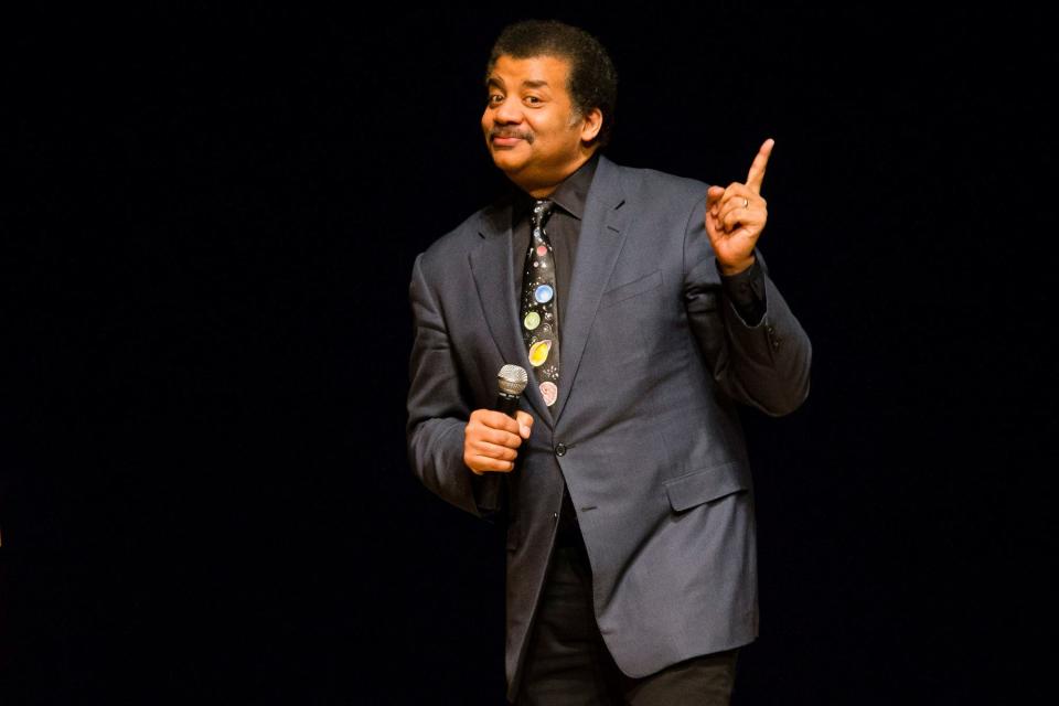 In this March 21, 2017 file photo, astrophysicist Neil deGrasse Tyson presents a lecture at the Morris Performing Arts Center in South Bend, Ind.