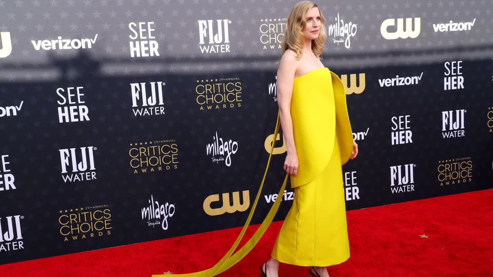 Actor Brit Marling was in head-to-toe Prada, including a yellow satin dress and black patent leather pumps. - Matt Winkelmeyer/Getty Images