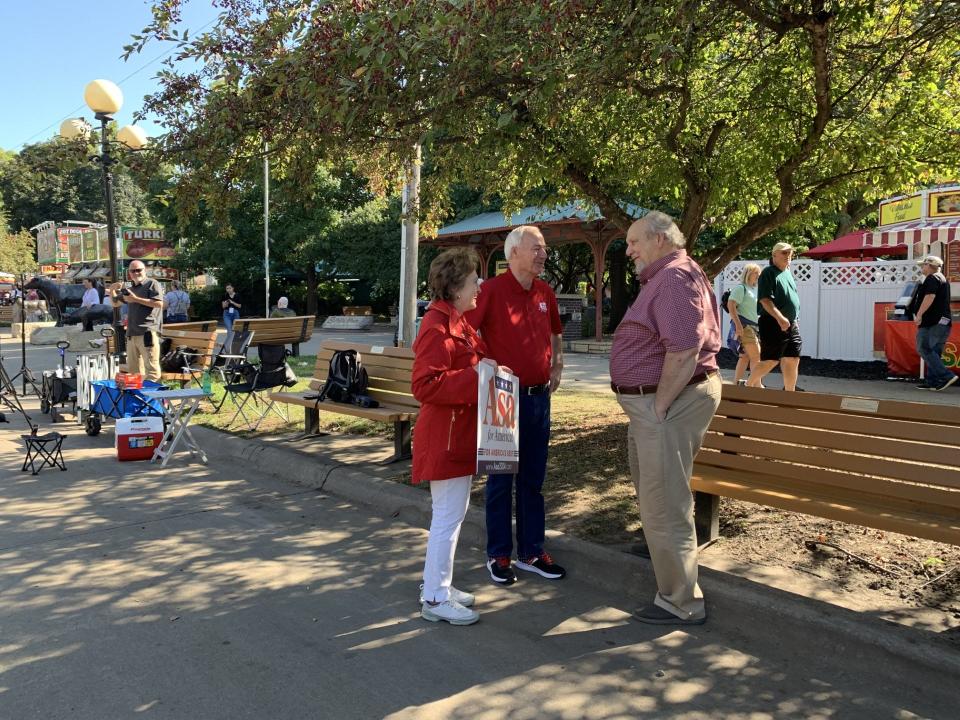 Republican candidate for president and former Arkansas Gov. Asa Hutchinson and his wife, Susan, converse with Iowa State Fair-goers while campaigning for the 2024 elections on Tuesday, Aug. 15, 2023.