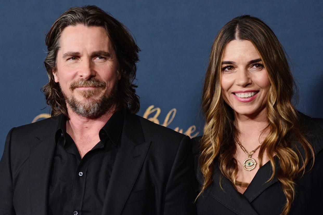 Christian Bale and Sibi Blažić attend "The Pale Blue Eye" Los Angeles Premiere at Directors Guild Of America on December 14, 2022 in Los Angeles, California.