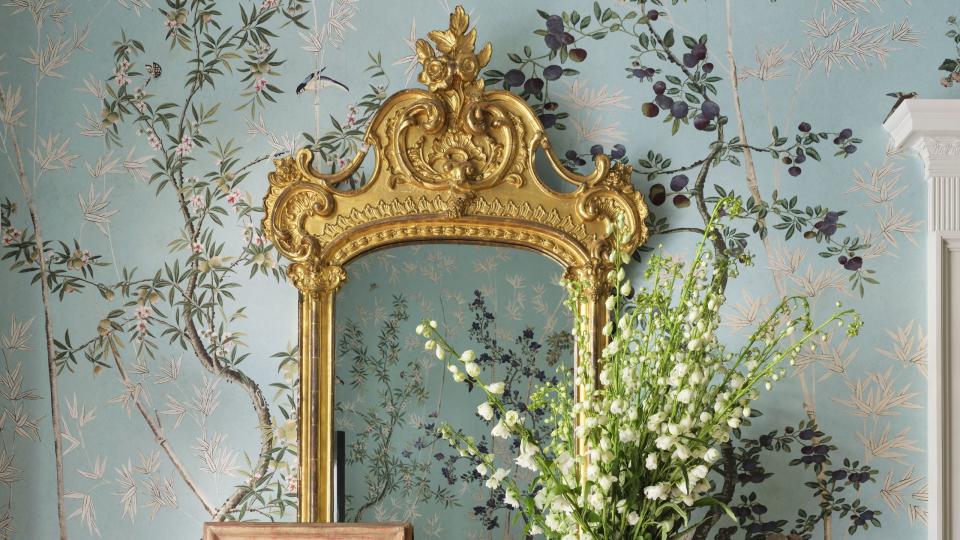 entry way, floral wallpaper, black side table