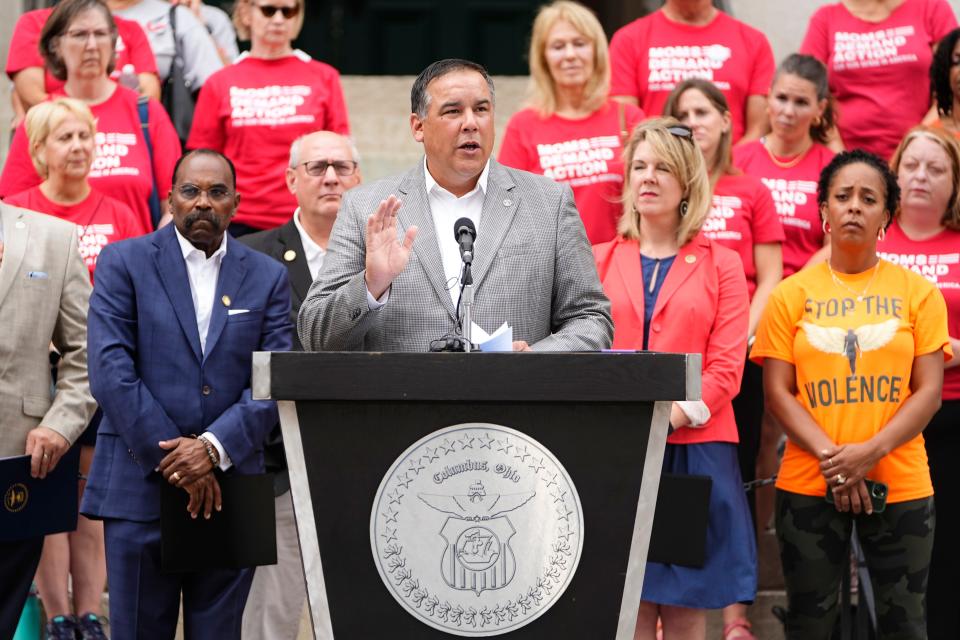 Columbus mayor Andrew Ginther speaks during a press conference with city and state officials demanding gun control reforms on the steps of the Ohio Statehouse.