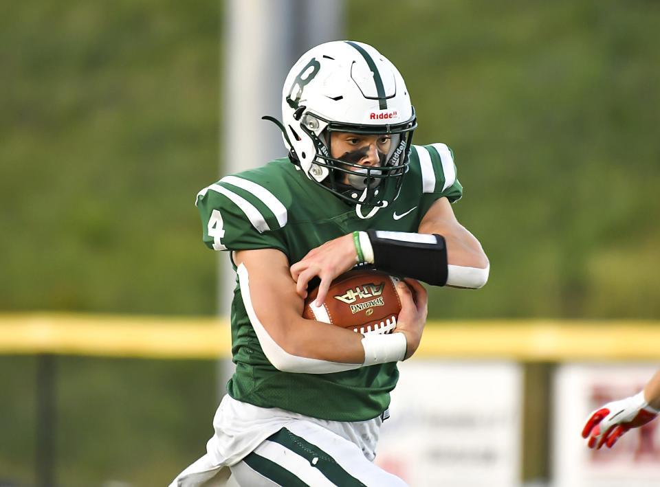 Jed Martin of Brossart runs for a big gain against Ludlow at the Brossart Athletic Complex on Friday, Sept. 24, 2021.