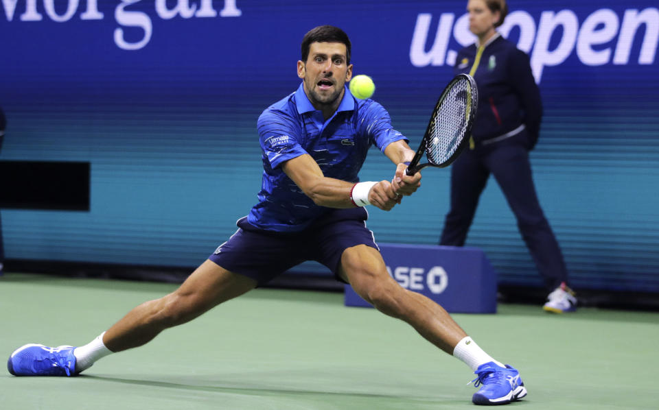 Novak Djokovic, of Serbia, returns to Juan Ignacio Londero, of Argentina, during the second round of the U.S. Open tennis tournament in New York, Wednesday, Aug. 28, 2019. (AP Photo/Charles Krupa)