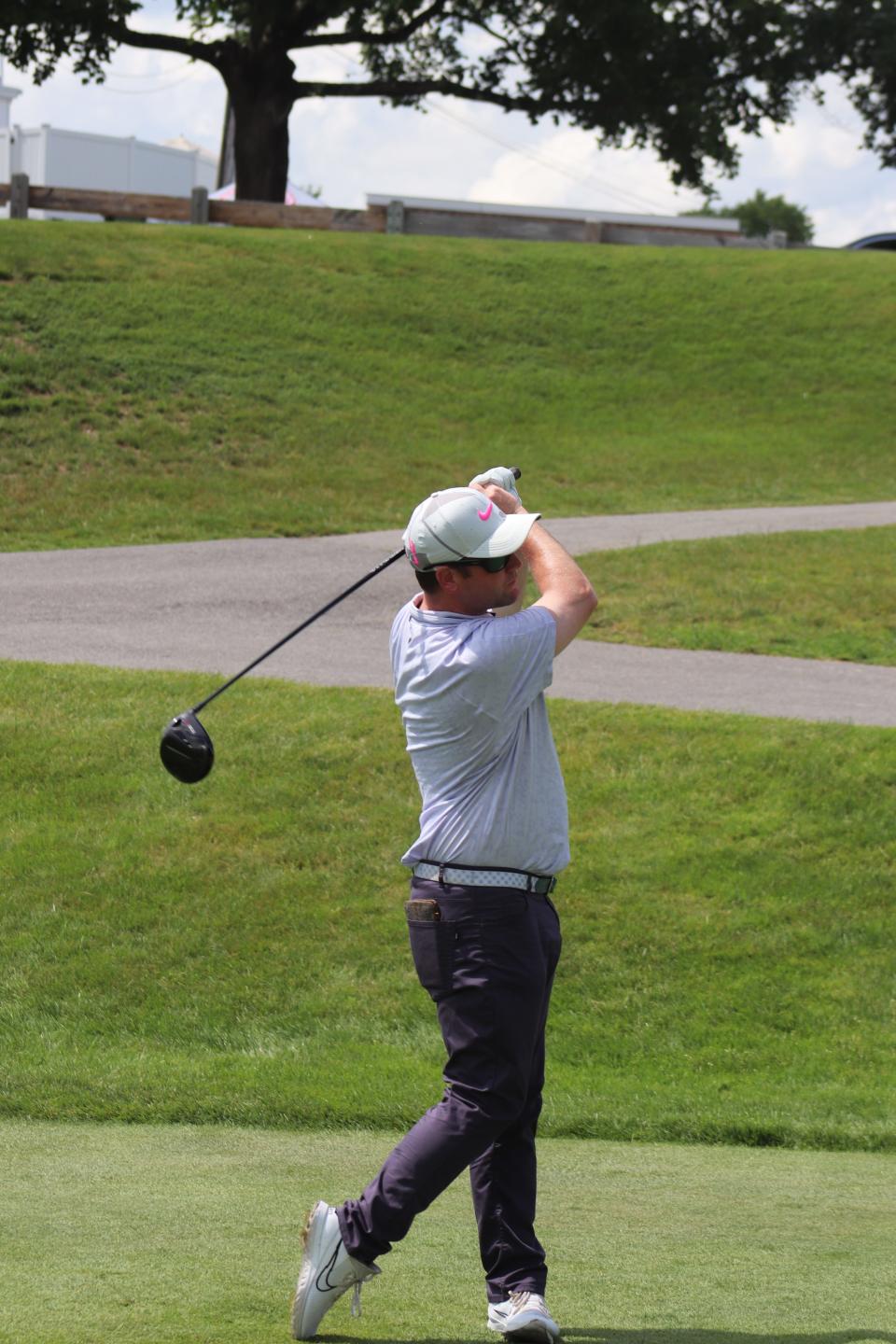 Ben Egan follows through after his drive on the 12th hole during a tournament at Oak Hill Country Club in Fitchburg last year.