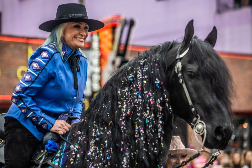 Tanya Tucker rides the horse “Lauwe The Magnificent” from the Country Music Hall of Fame to Lower Broadway to announce her upcoming Ryman performances Monday, April 3, 2023.