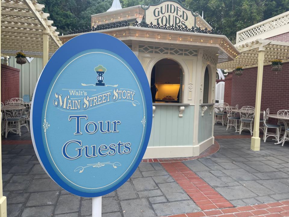 check-in sign for walt's main street story guided tour at disneyland