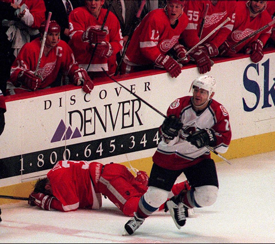 Avalanche forward Claude Lemieux skates away from a sprawled out Red Wings forward Kris Draper on Wednesday, May 29, 1996, in Denver. Lemieux was given a two-game suspension and a fine for the hit.
