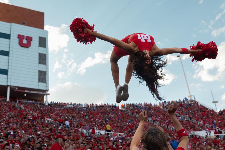 A University of Utah cheerleader does a flip during the season opener at Rice-Eccles Stadium in Salt Lake City on Thursday, Aug. 31, 2023. | Megan Nielsen, Deseret News