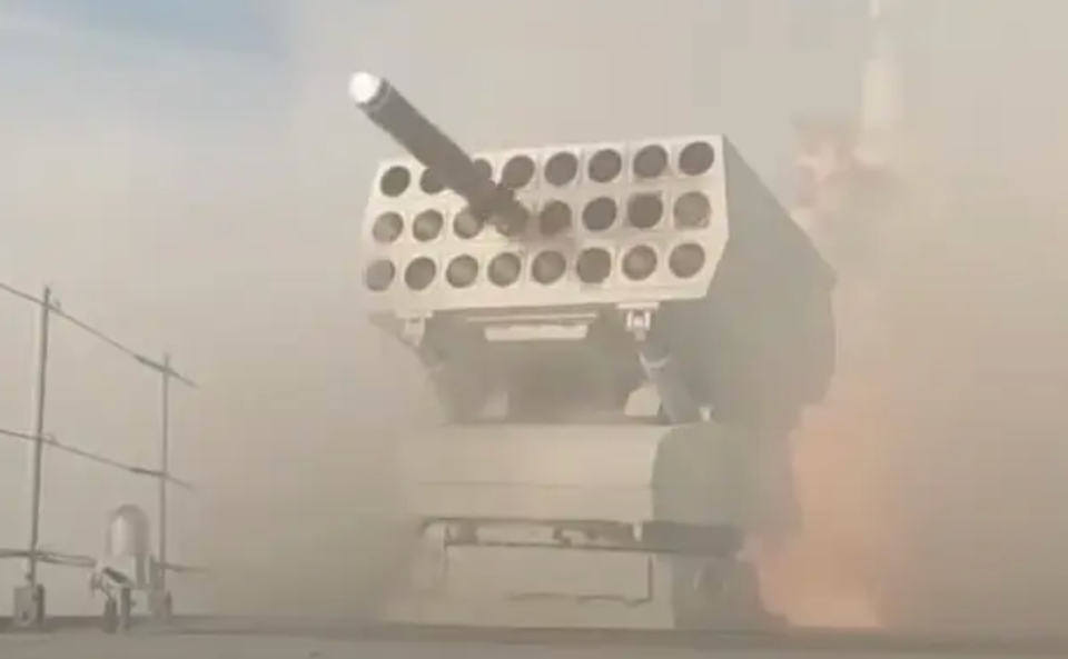 A screengrab from a Chinese state television broadcast showing a Type 726 series launcher on a Type 055 destroyer firing either a decoy of some kind or an anti-submarine rocket. <em>CCTV capture via YouTube</em>