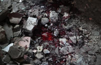 A puddle of blood is seen amid debris of a building after a Russian air raid in Lysychansk, Luhansk region, Ukraine, Thursday, June 16, 2022. (AP Photo/Efrem Lukatsky)