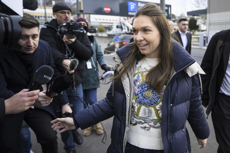 FILE - Two-time Grand Slam champion Simona Halep is surrounded by media before a hearing at the international Court of Arbitration for Sport in Lausanne, Switzerland, Wednesday, Feb. 7, 2024. Flying to Florida for the Miami Open last month, where she would be playing in a professional tennis match for the first time in 1 1/2 years after successfully reducing a doping ban on appeal, Simona Halep turned to her mother and offered a bit of a confession. “I'm very nervous,” Halep recalled telling her mother. (Laurent Gillieron/Keystone via AP, File)