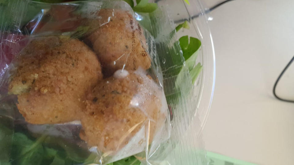 A customer claims there was fuzzy mould in the salad he bought from Woolworths. Source: Cristiaan Ven Palt/Facebook