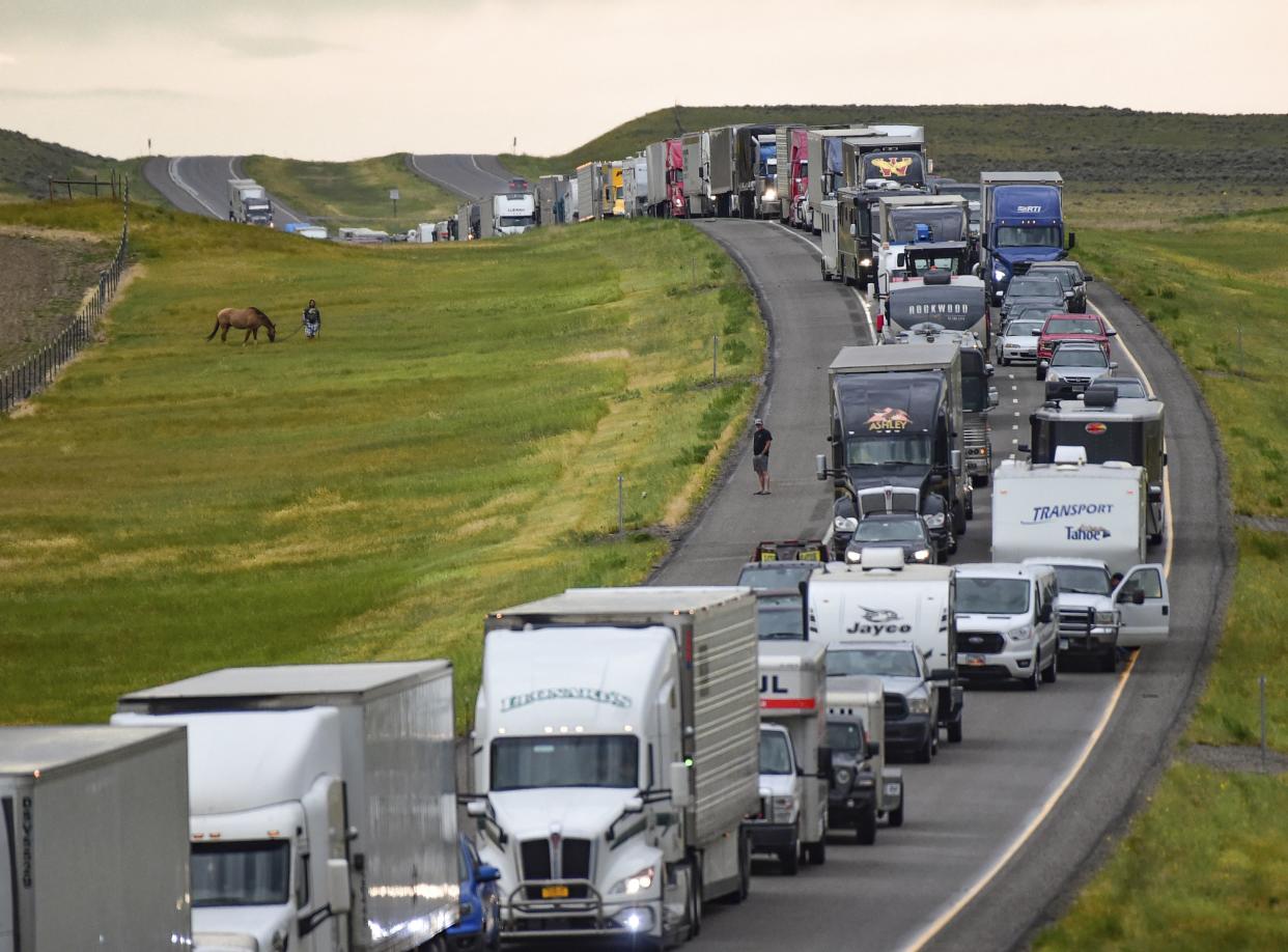 Traffic is backed up on Interstate 90 after a fatal pileup where at least 20 vehicles crashed near Hardin, Mont., Friday, July 15, 2022. 