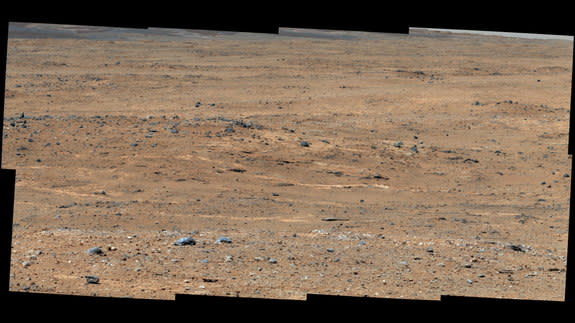 An outcrop visible as light-toned streaks in the lower center of this image has been chosen as a place for NASA's Mars rover Curiosity to study for a few days in September 2013. The pause for observations at this area, called "Waypoint 1," is