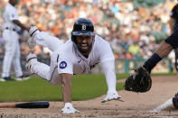 Detroit Tigers' Riley Greene beats the tag of Cleveland Guardians catcher Luke Maile during the second inning of a baseball game, Tuesday, July 5, 2022, in Detroit. (AP Photo/Carlos Osorio)