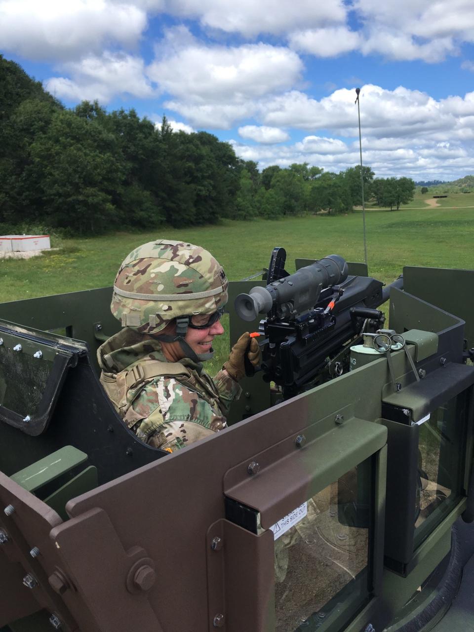 General Daniels firing a grenade launcher