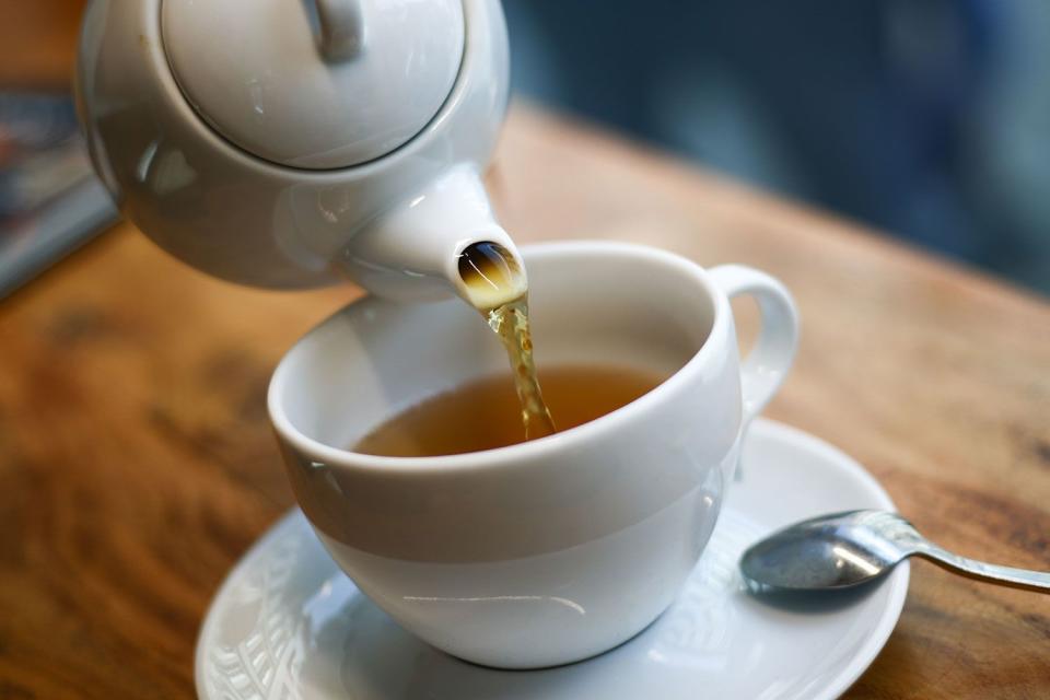<p>Jakub Porzycki/getty</p> Stock image of tea being poured into a cup