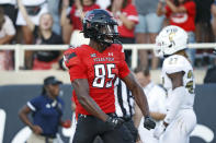 Texas Tech's Trey Cleveland (85) yells after scoring a touchdown during the second half of an NCAA college football game against Florida International, Saturday, Sept. 18, 2021, in Lubbock, Texas. (AP Photo/Brad Tollefson)