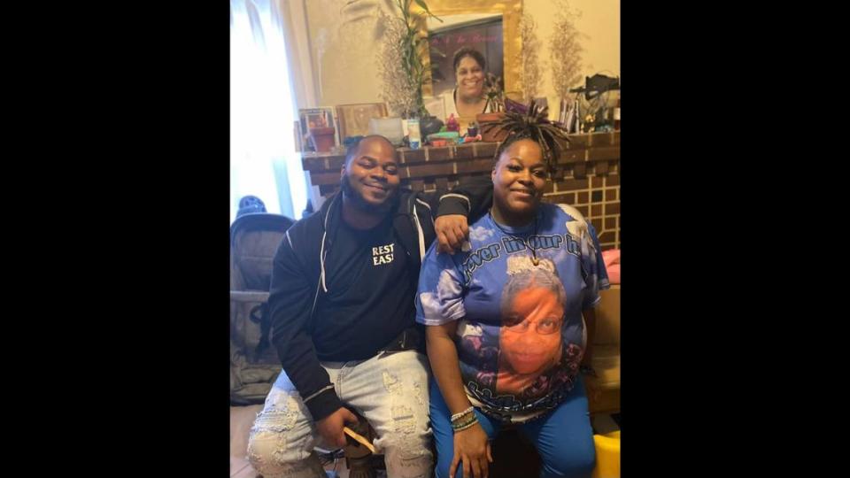 Amaree’ya Rashon Henderson and his mother, Pauletta Johnson, sit in front of a photo of Johnson’s late mother in winter 2022.