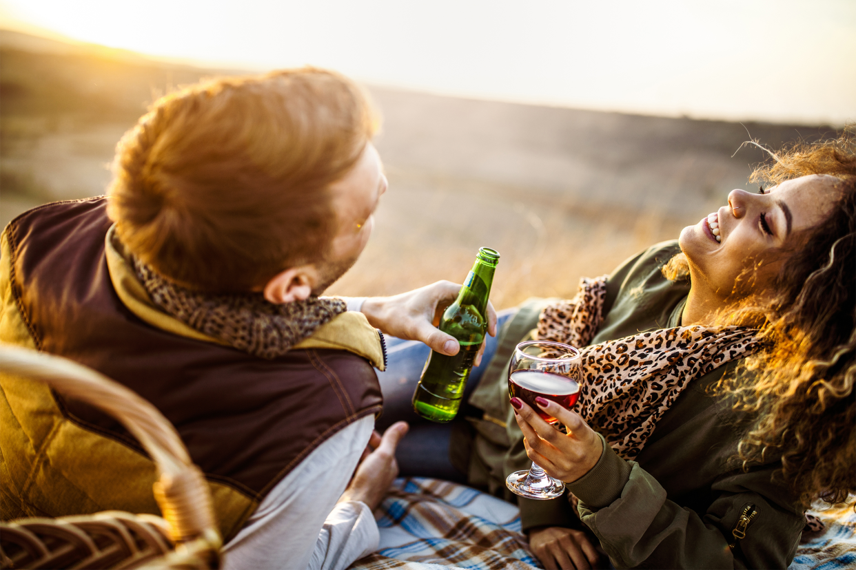 Man and woman drinking outside